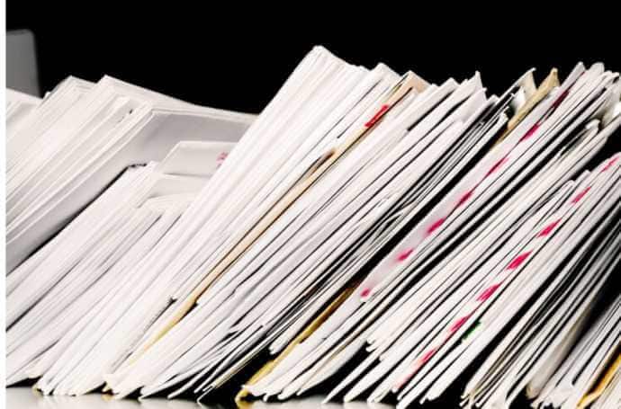 a stack of paper documents