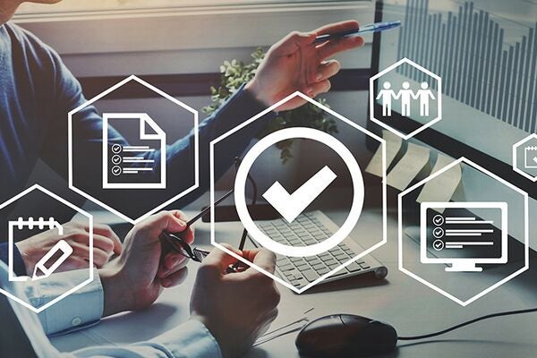 abstract white icons in individual hexagon outlines - a document, a notepad, a tick sign, a monitor and 3 people overlaying an image of two people's hands discussing something whilst sat a desk and pointing at a monitor